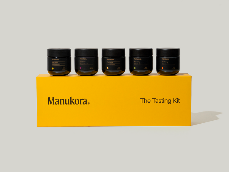 The tasting kit box with all 5 different strength jars on top of it.